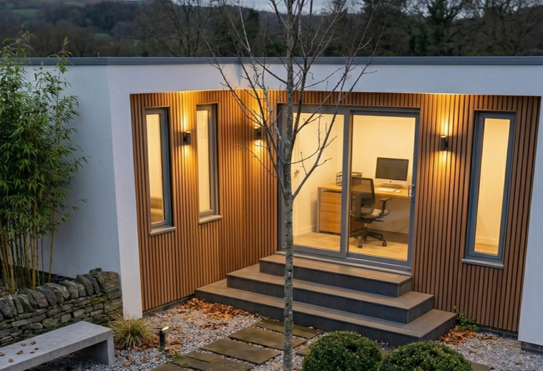 L-shaped garden room studio with timber cladding