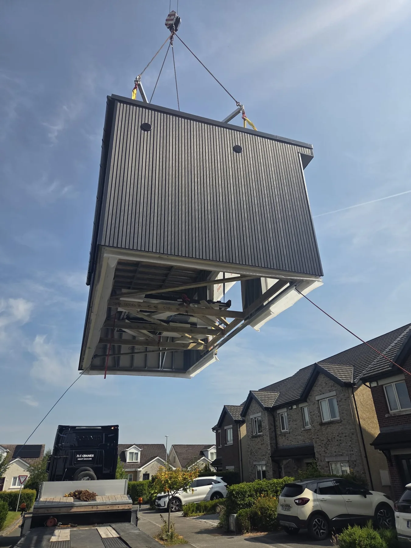 Garden room lifted by crane at the customer's property